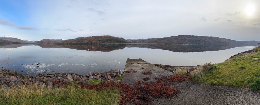 A tow truck pulled over on a remote Scottish Highland road